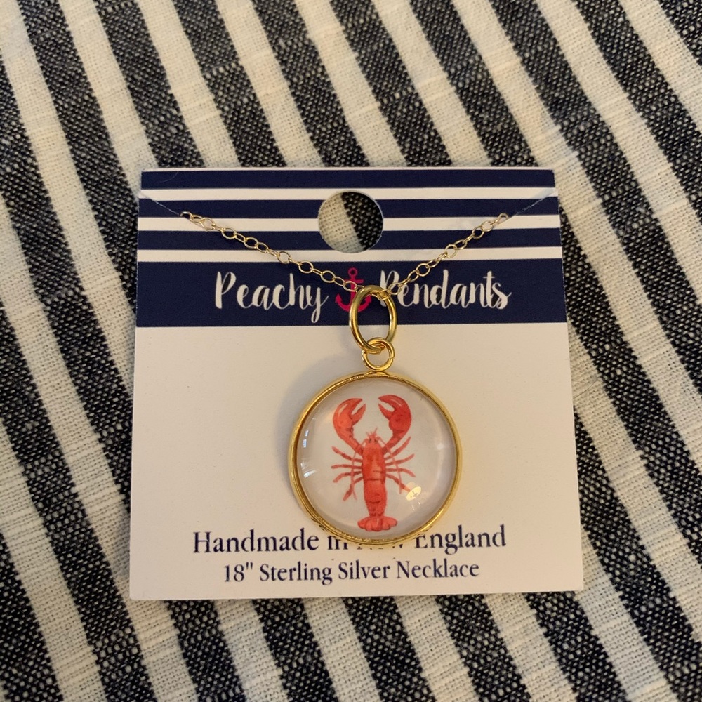 Gold necklace and lobster pendant